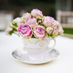 pink flowers in teacup